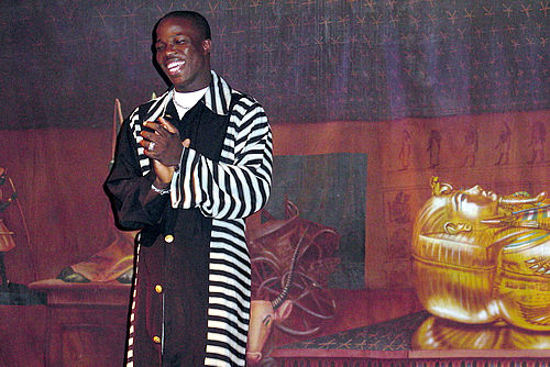 Kunle accepts applause for his Moshood fashion show, Norfolk 2000 TAG TEAM Convention