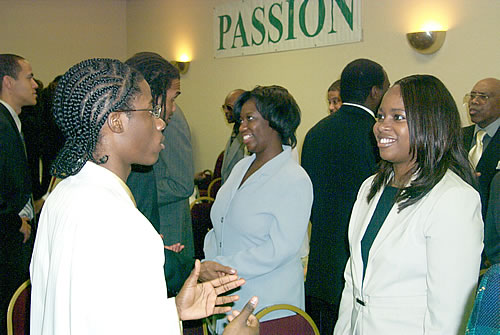 Audience participating in group exercise, Los Angeles, California Black Business Seminar