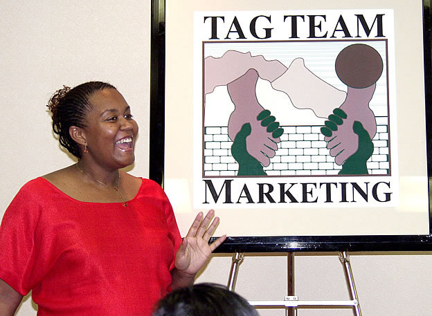 Debbie speaking to audience, Los Angeles, California Black Business Seminar