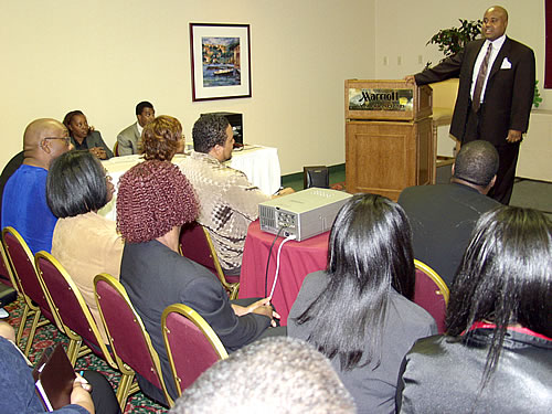 Delxino speaking to the audience, Los Angeles, California Black Business Seminar