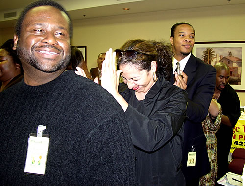 Audience participating in group massage, Los Angeles, California Black Business Seminar