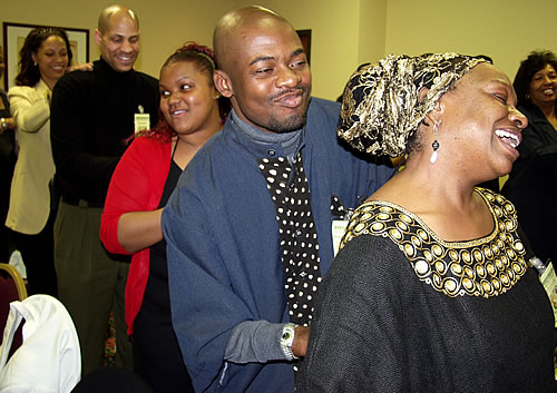 Audience participating in group massage, Los Angeles, California Black Business Seminar