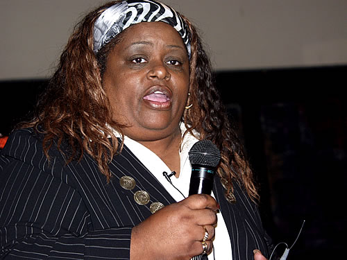 Vanessa speaking on stage, New York City Black Business Seminar