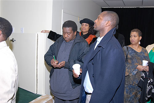 Guests listening to Delxino explain purpose of the TAG TEAM Presentation Room, TAG TEAM Marketing Atlanta Facility Grand Opening