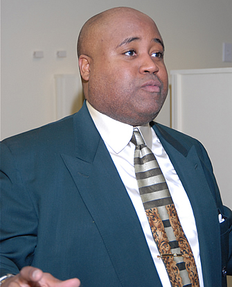 Delxino explaining the function of the TAG TEAM Presentation Room, TAG TEAM Marketing Atlanta Facility Grand Opening