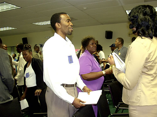 Audience doing group excercise, Atlanta, Georgia Black Business Seminar
