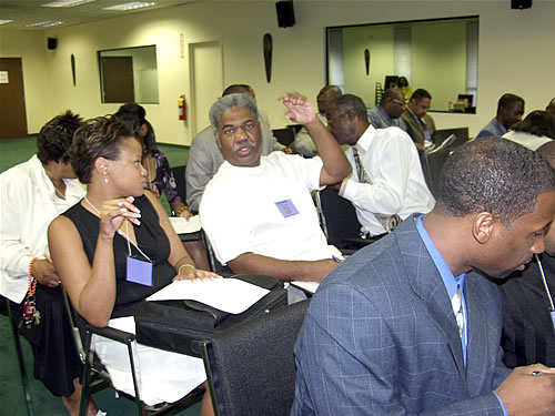 Audience doing group excercise, Atlanta, Georgia Black Business Seminar